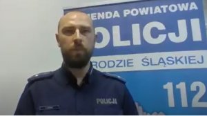 policjant na tle baneru